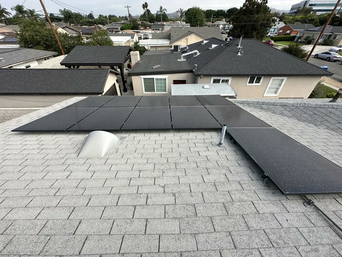 A roof ventilator and a plumbing vent stack standing in the roof plane, with the array stopping short of them